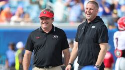 Kirby Smart and Billy Napier laugh before the Georgia-Florida game.