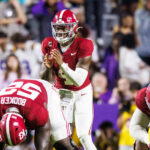 Jalen Milroe prepares to catch the snap during an Alabama game in 2024.