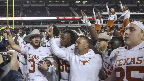 Texas coach Steve Sarkisian and players celebrate.