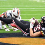 Preston Howard is shown catching a touchdown.