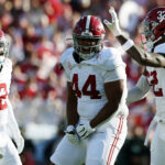 Damon Payne celebrates after a play against Michigan in the Rose Bowl