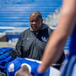 Vince Marrow is shown coaching at Kentucky.