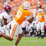 Holden Staes attempts to catch a pass in a Tennessee game.