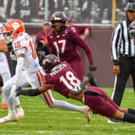 Mose Phillips dives to make a tackle against Clemson.