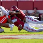 DeVonta Smith makes a tackle on Mercer RB CJ Miller.