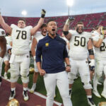Notre Dame head coach Marcus Freeman is shown.