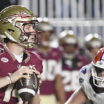Luke Kromenhoek looks to throw a pass in Florida State's game against Florida