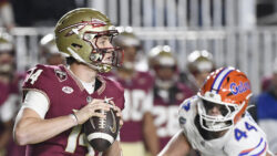 Luke Kromenhoek looks to throw a pass in Florida State's game against Florida