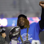 Ashton Jeanty celebrates Boise State's Mountain West championship.