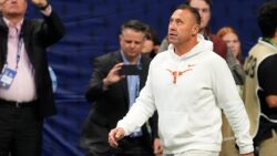 Steve Sarkisian walks the sideline.