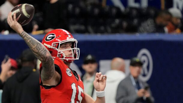Carson back throws a pass.