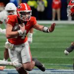 Gunner Stockton runs the ball in the SEC title game.