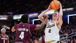 Texas A&M's Wade Taylor IV guards Purdue's Fletcher Loyer.