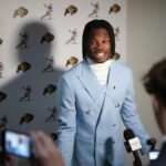 Travis Hunter meets with media ahead of the Heisman ceremony.