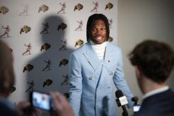 Travis Hunter meets with media ahead of the Heisman ceremony.