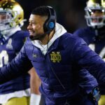 Notre Dame coach Marcus Freeman celebrates a Playoff win.