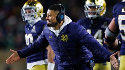 Notre Dame coach Marcus Freeman celebrates a Playoff win.
