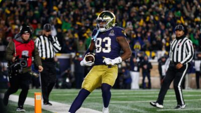 Notre Dame's Jayden Thomas is shown scoring a touchdown.