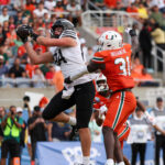 Iowa State and Miami players in action during the Pop-Tarts Bowl.