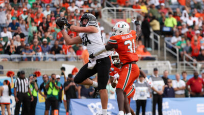Iowa State and Miami players in action during the Pop-Tarts Bowl.