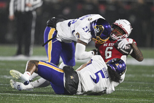 ECU and NC State players in action.