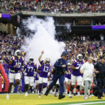 LSU runs out of the tunnel at the Texas Bowl.