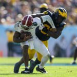Alabama QB Jalen Milroe gets tackled.