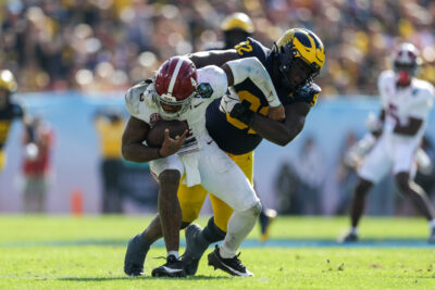 Alabama QB Jalen Milroe gets tackled.