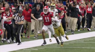 Parker Jones collides with a ref during the Notre Dame vs. Georgia game.