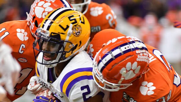 LSU and Clemson players battle.