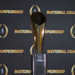 College Football Playoff trophy is shown.