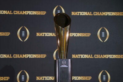 College Football Playoff trophy is shown.