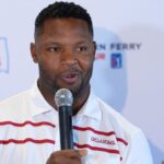 Curtis Lofton is shown speaking.