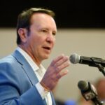 Louisiana Governor Jeff Landry speaks to a crowd.