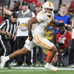 Holden Staes catches a pass for Tennessee.
