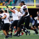 Northern Illinois players celebrate beating Notre Dame.