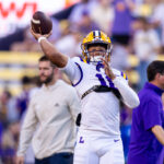 Colin Hurley throws a pass while warming up before a game.