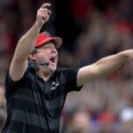 Kirby Smart is shown on the sidelines.
