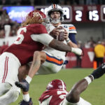 Alabama DL Tim Keenan III tackles Auburn QB Payton Thorne.