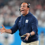 James Franklin is shown on the sidelines.