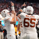 Quinn Ewers and Texas celebrate.