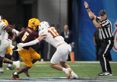 Michael Taaffe lays a hit for Texas.