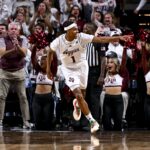 Zhuric Phelps celebrates scoring a basket against Texas.