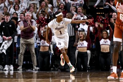 Zhuric Phelps celebrates scoring a basket against Texas.