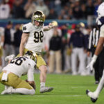Mitch Jeter kicks the ball.