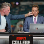 Nick Saban is shown with Pat McAfee.