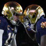 Notre Dame football shiny gold helmets.
