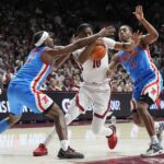 Ole Miss plays defense on Alabama.