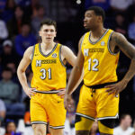 Mizzou basketball players Caleb Grill and Tony Perkins during a game against Florida.