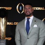 Marcus Freeman is shown with the CFP trophy.